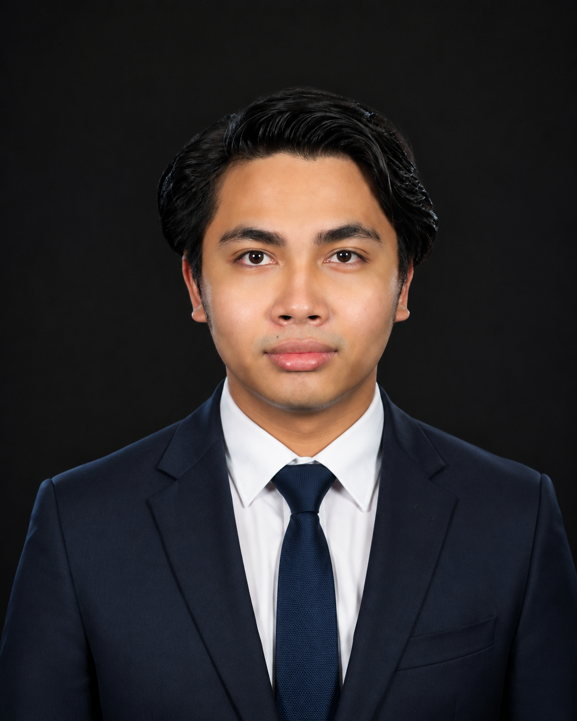 A professional portrait of Adam Farhan